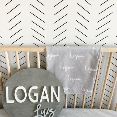 Picture of a nursery with black thin herringbone wall decals