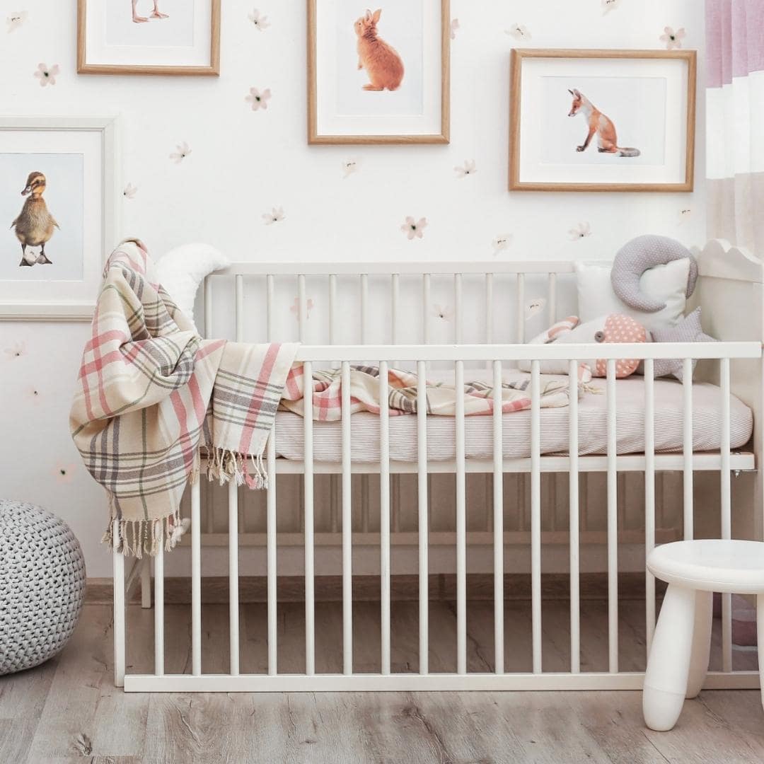 Picture of a nursery with dusty rose and vintage white flower wall decals