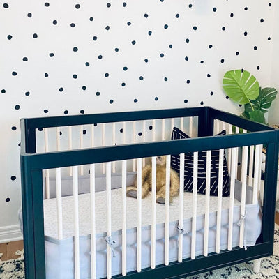 Picture of a nursery with black irregular dots wall decals