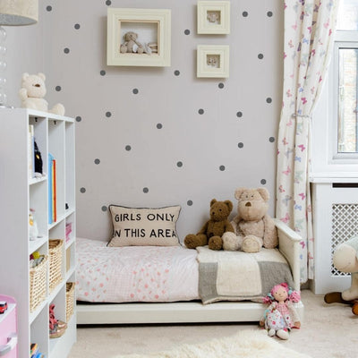 Picture of a bedroom with small dots in dark grey wall decals