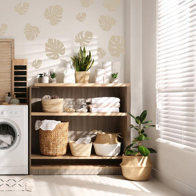 Picture of a laundry room with beige tropical leaves wall decals