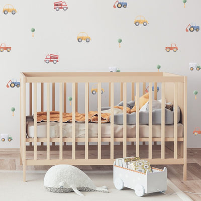 Picture of a nursery with colourful cars, trucks and tree wall decals