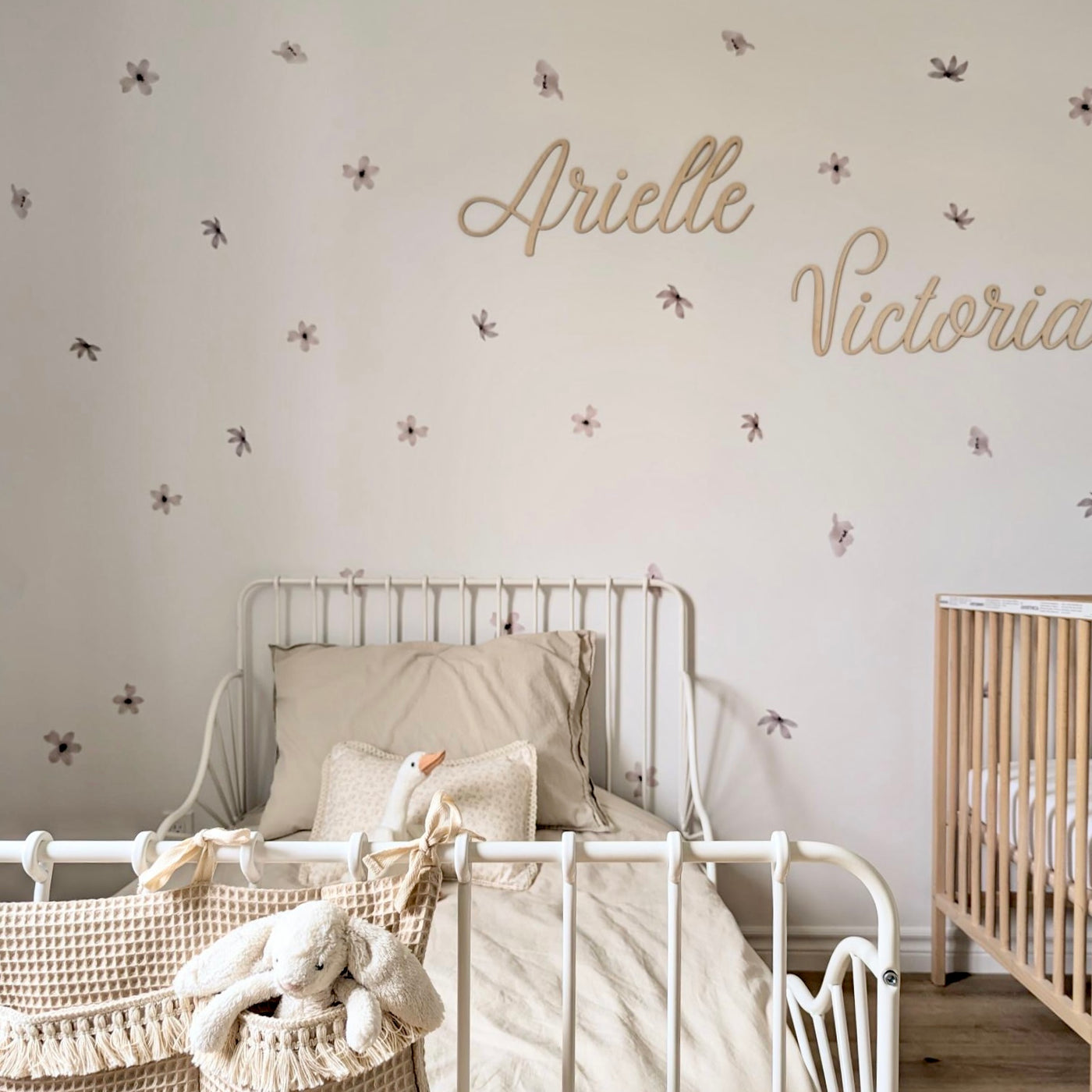 Delicate brown and taupe flower fabric wall decals in a little girls room featuring intricate floral designs. 