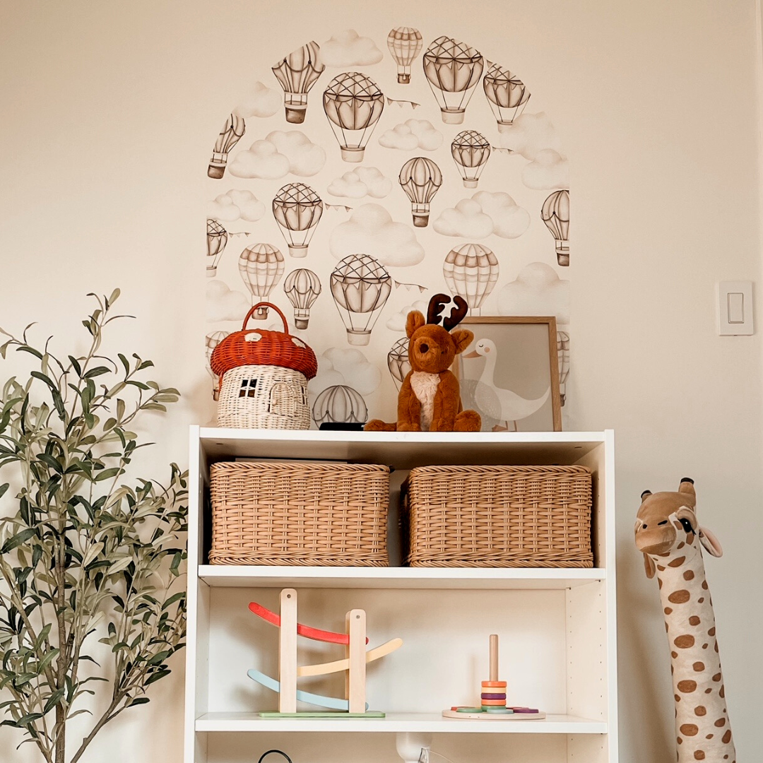 Soft and whimsical fabric wall decals featuring neutral-toned hot air balloons featured in an arch. These non-toxic decals are removable and perfect for adding a calming and dreamy atmosphere to nurseries or children's rooms.