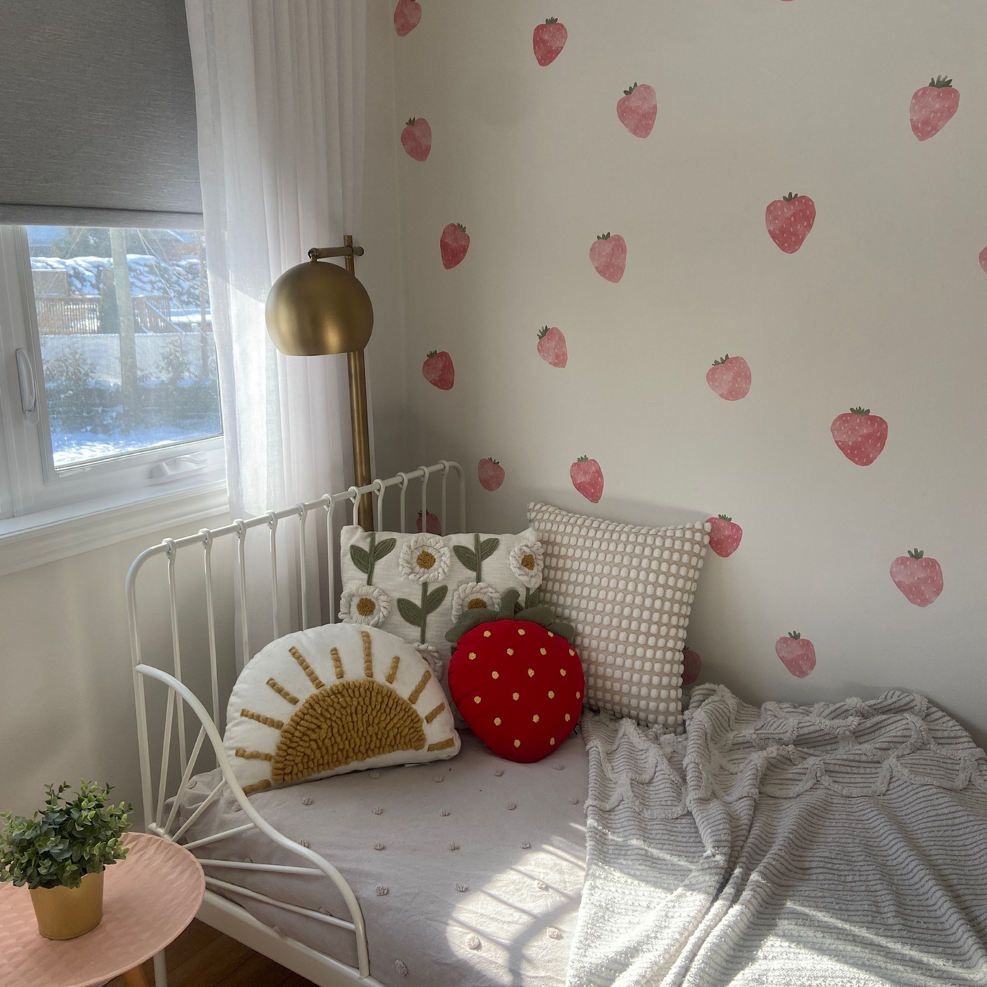 Fabric wall decals featuring vibrant strawberries with green leaves in a little girls room, perfect for adding a fresh and cheerful touch. 