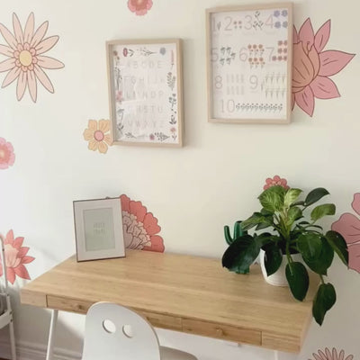 Video of large fabric wall decals showcasing vibrant boho flowers in peach and apricot in a little girls room, perfect for adding a bold and artistic flair. 