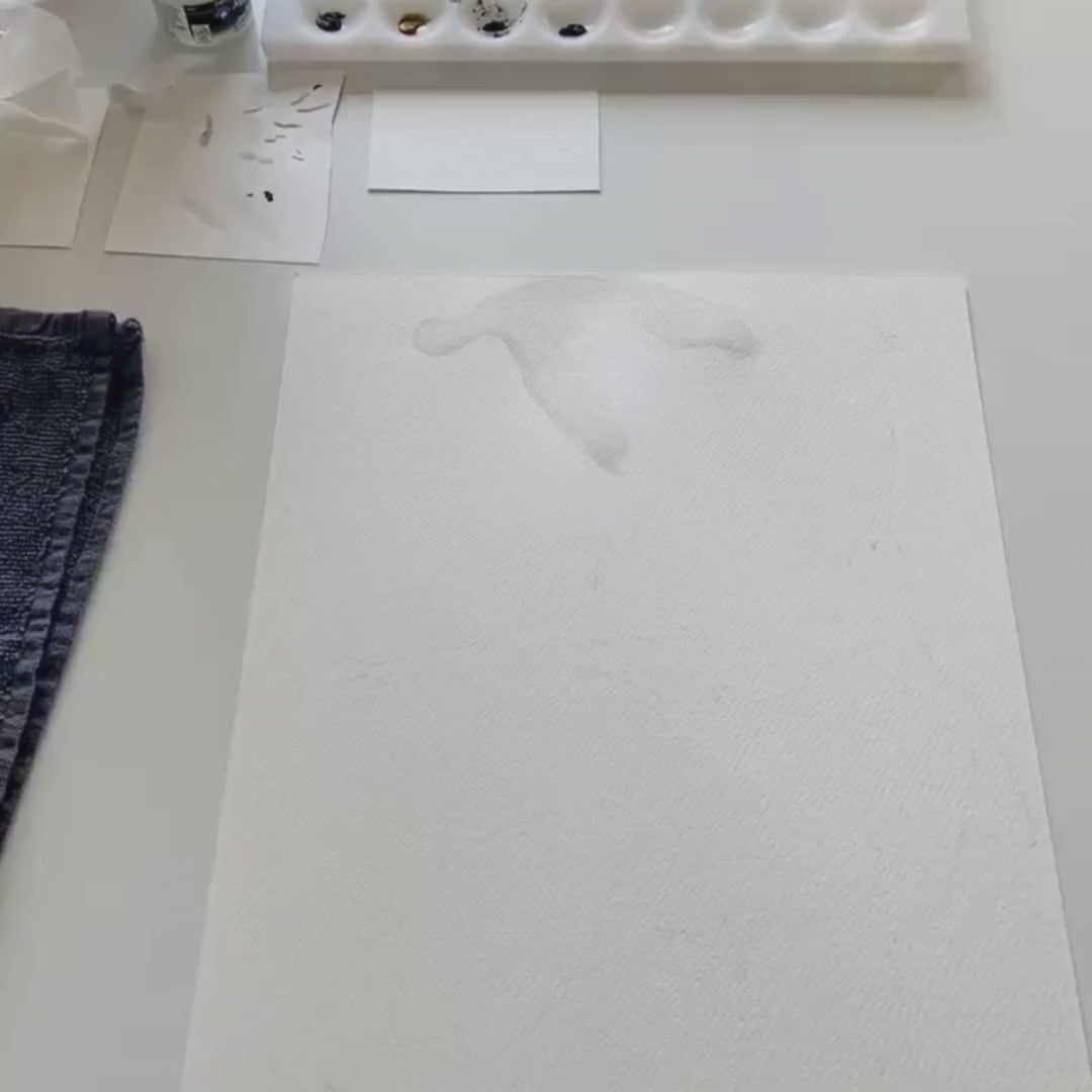 Video of Sabina the artist skillfully creating stork and cloud fabric wall decals, showcasing the artistic process from sketching to application, providing insight into the design and crafting techniques.