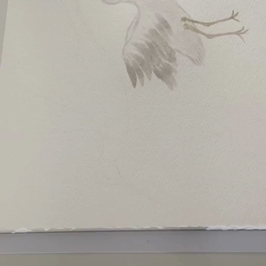 Video of Sabina the artist skillfully creating stork and cloud fabric wall decals, showcasing the artistic process from sketching to application, providing insight into the design and crafting techniques.