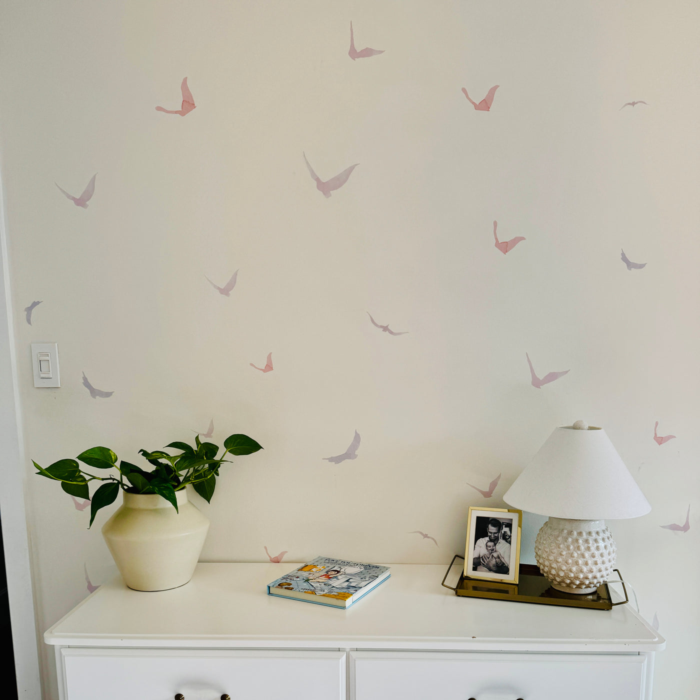 A vibrant assortment of colourful silhouette bird wall decals in various sizes, that add a whimsical touch to any space.