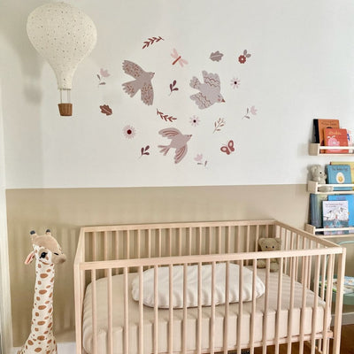 Boho bird fabric wall decals in a neutral color palette, in a nursery featuring soft tones that enhance the decor of any space while adding a touch of nature-inspired charm.