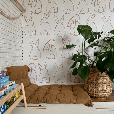 The cutest bohemian play room with bunny bum wall decals wall decals adding a playful touch to the room. 