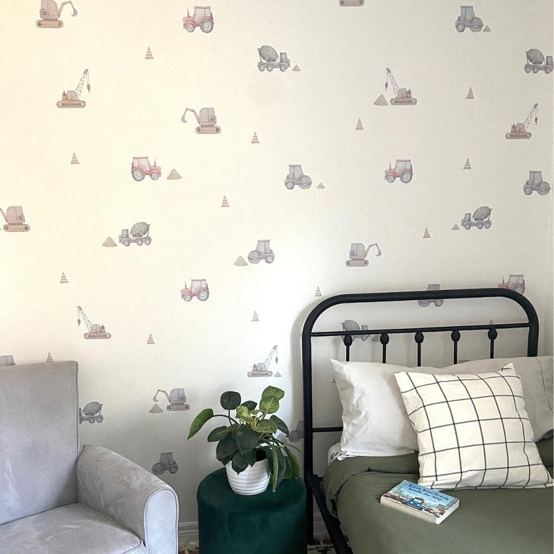 Fabric wall decals in a little boys room showcasing various construction trucks, including diggers, dump trucks, and cranes, ideal for decorating a child's room or play area with a construction theme