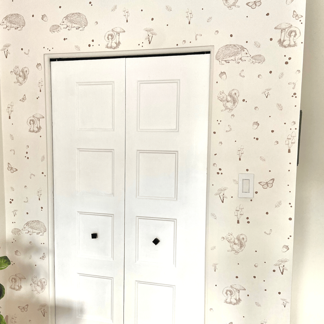 Picture of a closet door with light brown woodland wall decals