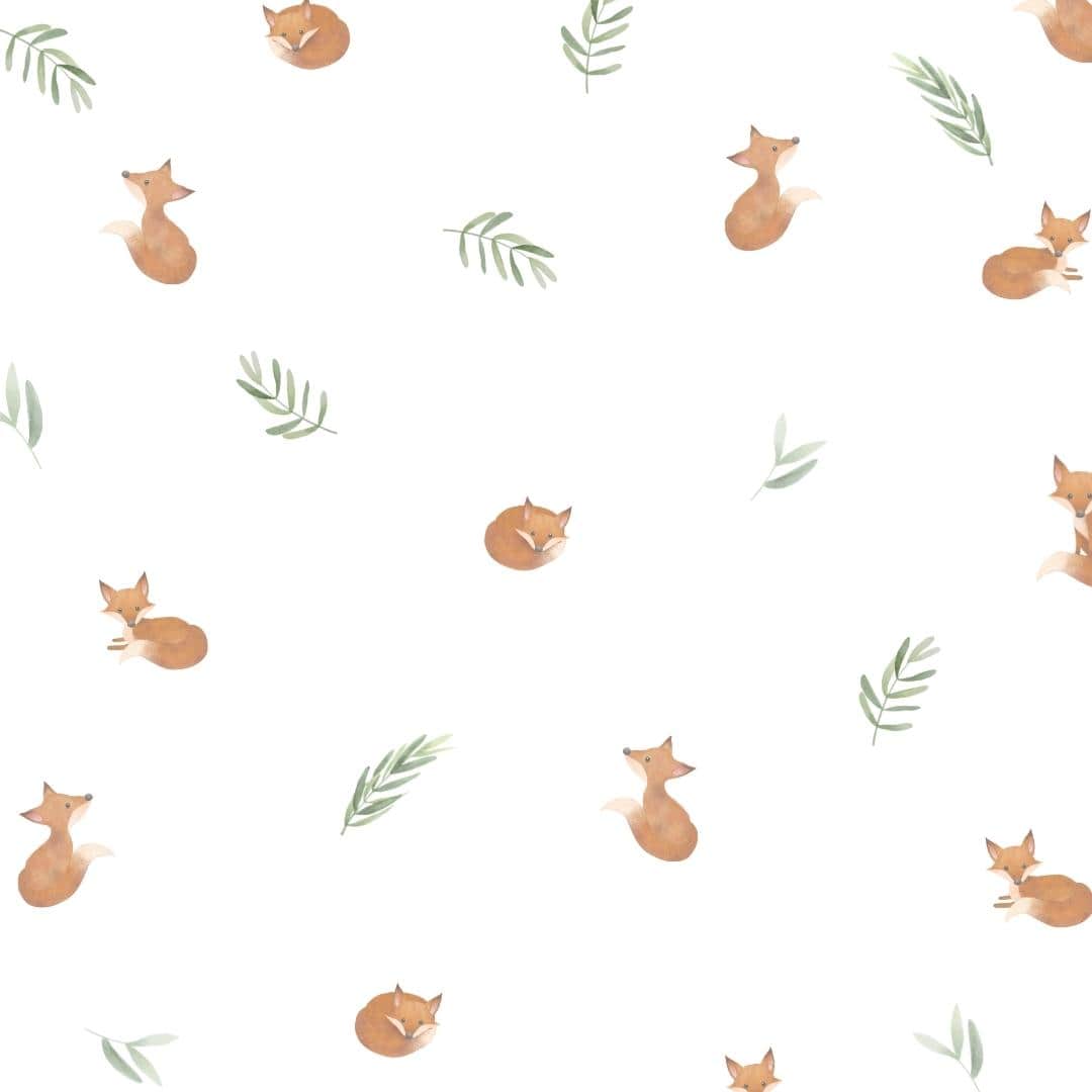 Adorable baby fox wall decals nestled among soft sage green leaves. These non-toxic fabric decals are removable, ideal for creating a cozy and playful atmosphere in a child's room.