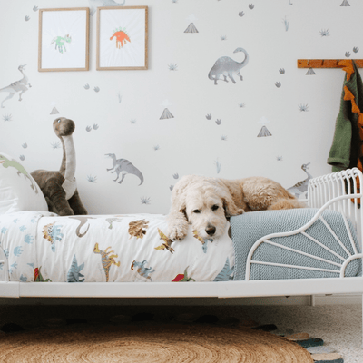 Children's bedroom with watercolour grey tone dinosaur wall decals