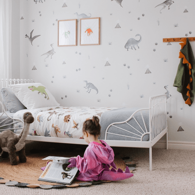 Children's bedroom with watercolour grey tone dinosaur wall decals