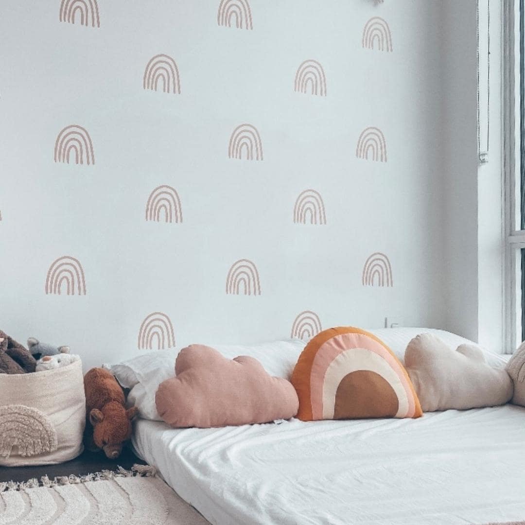 Picture of a bedroom with minimalist rainbow wall decals in dusty rose