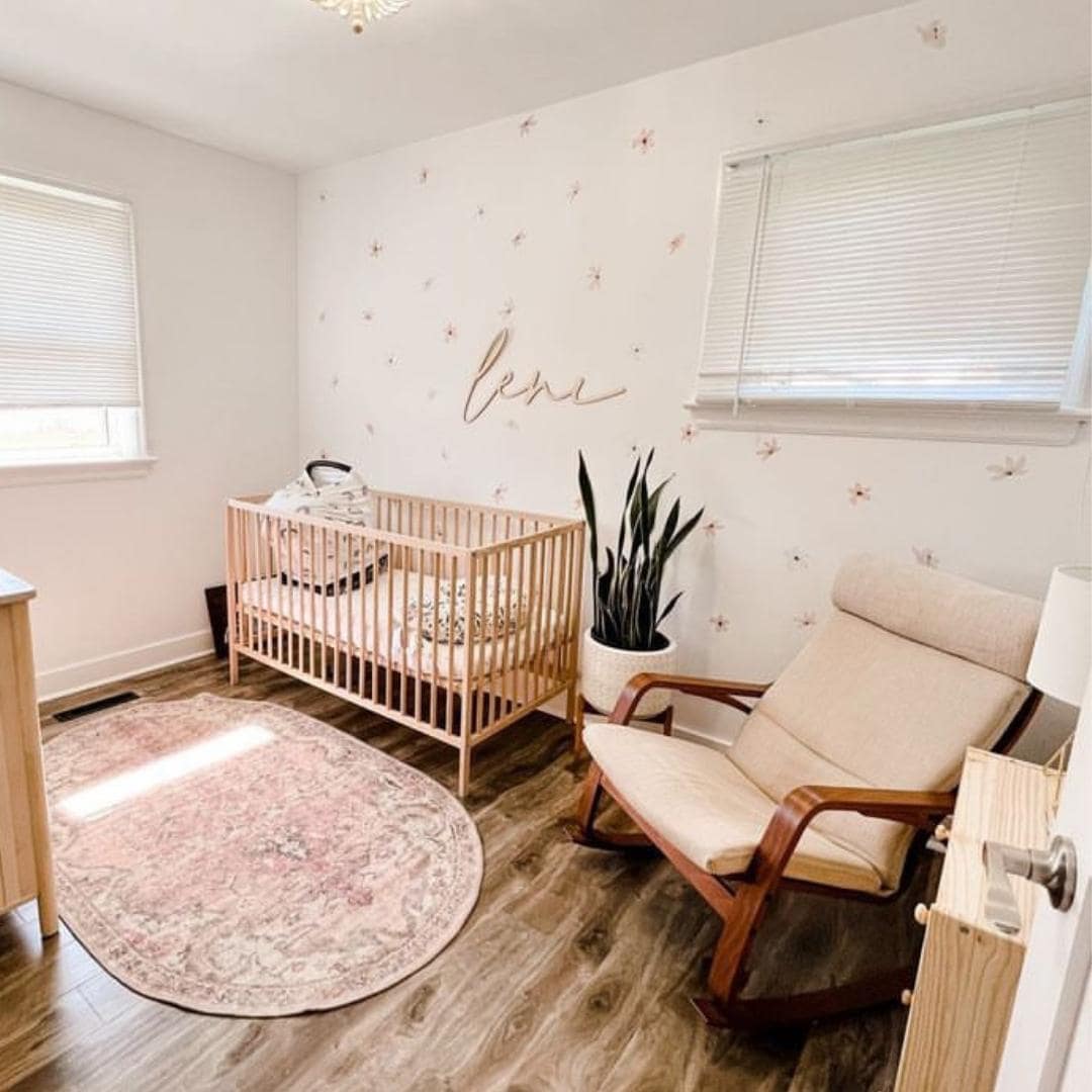 Elegant fabric wall decals featuring a soft dusty rose colour paired with vintage white flowers in a little girls room, crafted from non-toxic materials, perfect for creating a serene and stylish atmosphere in any room.
