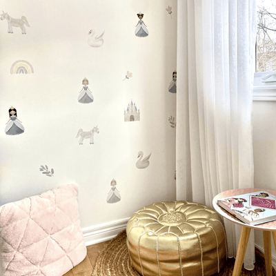 Fabric wall decals featuring enchanting princess designs in a little girls room, ideal for adding a magical and royal touch. 