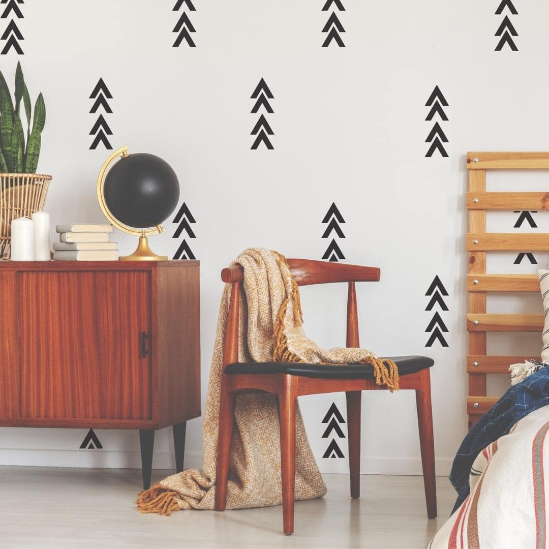 Picture of a bedroom with black thick chevron arrow wall decals