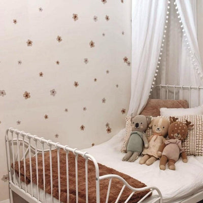 Picture of a children's bedroom with watercolour warm brown and white small flowers wall decals  Edit alt text